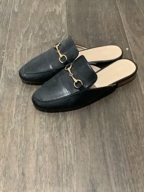 Black buckle mules